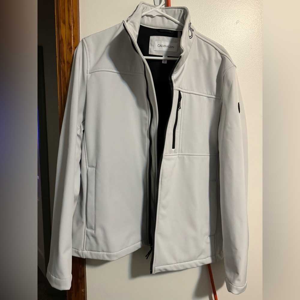Calvin Klein. Mens size medium. White coat